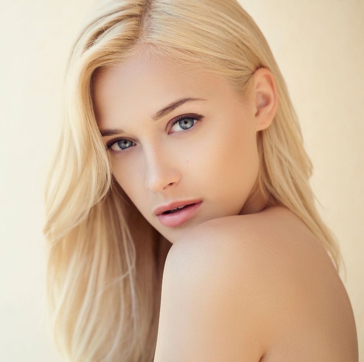 A beautiful blonde woman looking at the camera.