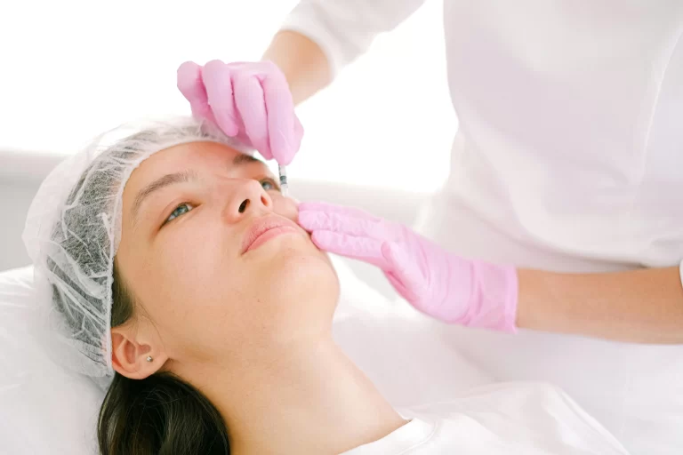 A woman receiving Botox, Jeuveau, or another treatment.