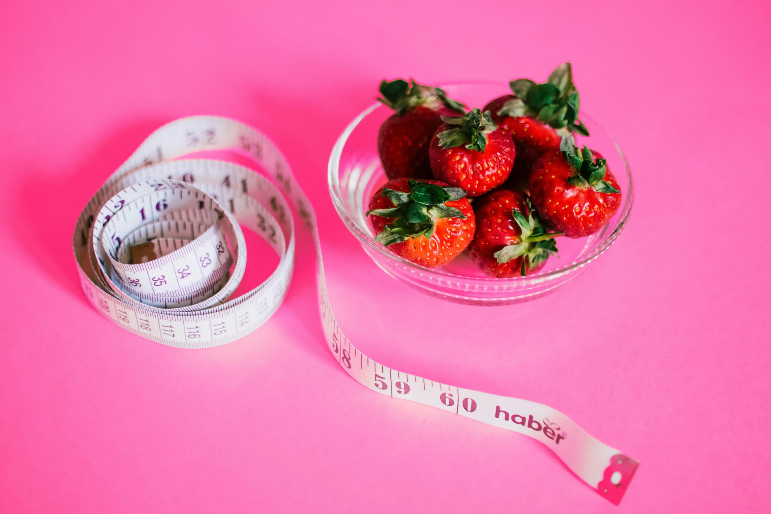 Tape Measure and Strawberries in a Bowl