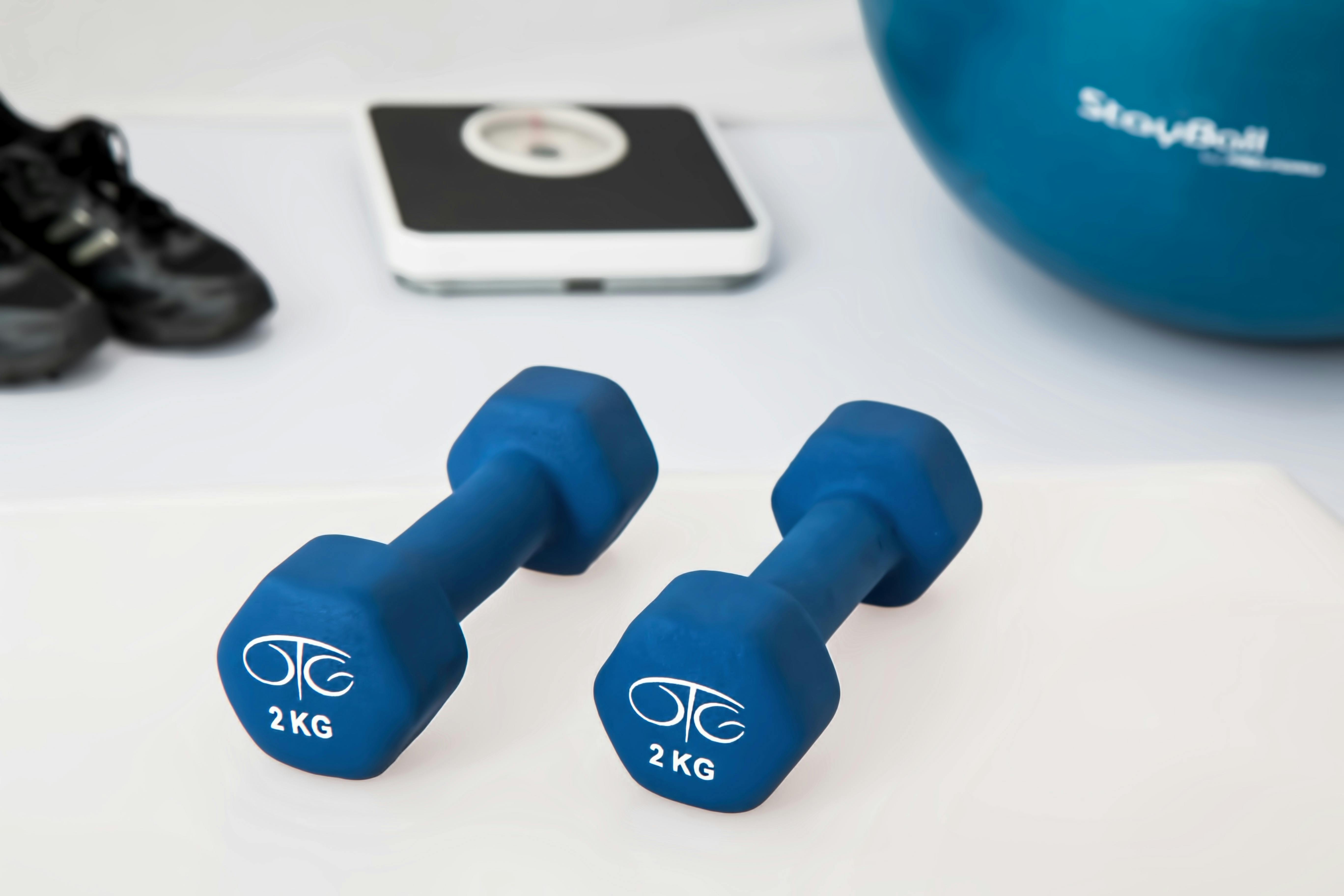 Weights on the floor in front of a scale