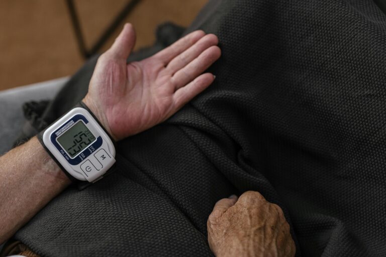 Person looking at their blood pressure