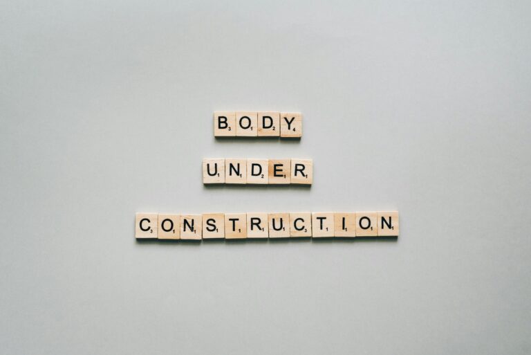 Body under construction written in scrabble letters
