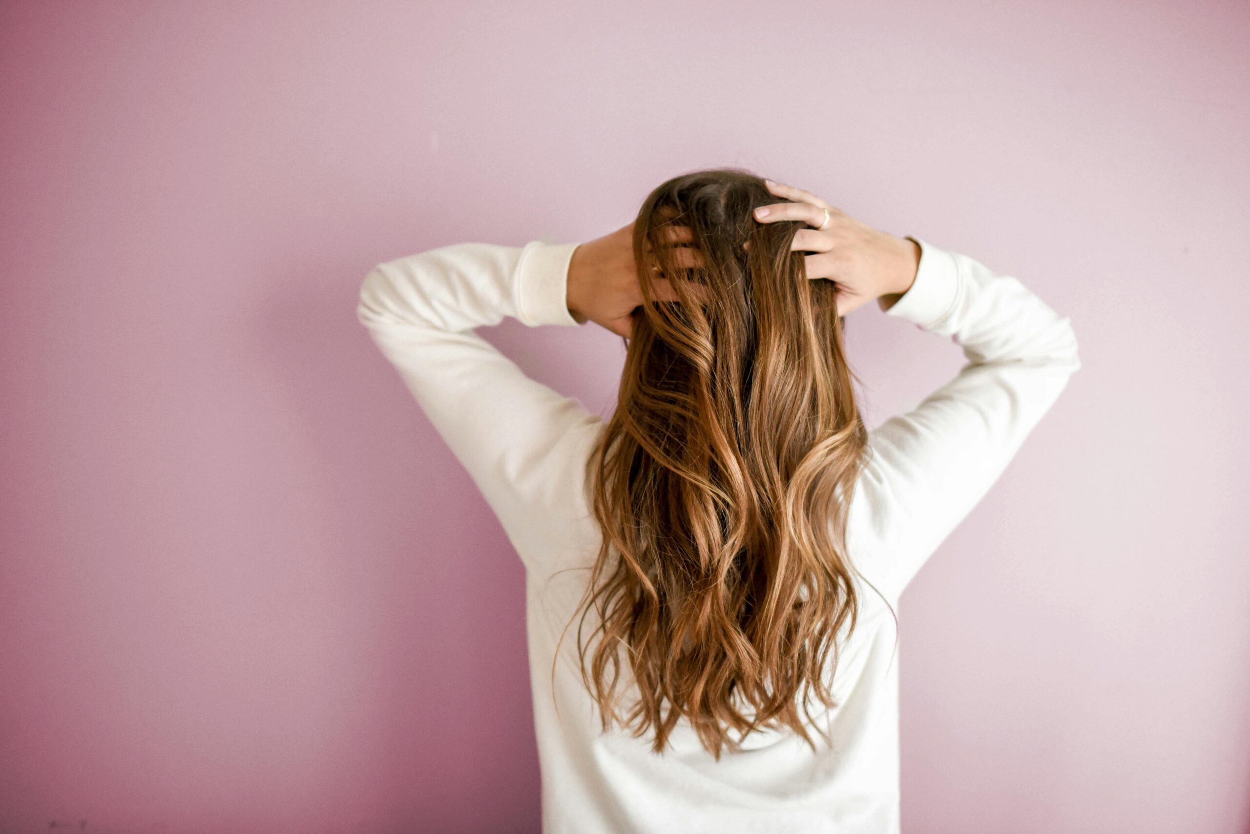 Person holding their hair