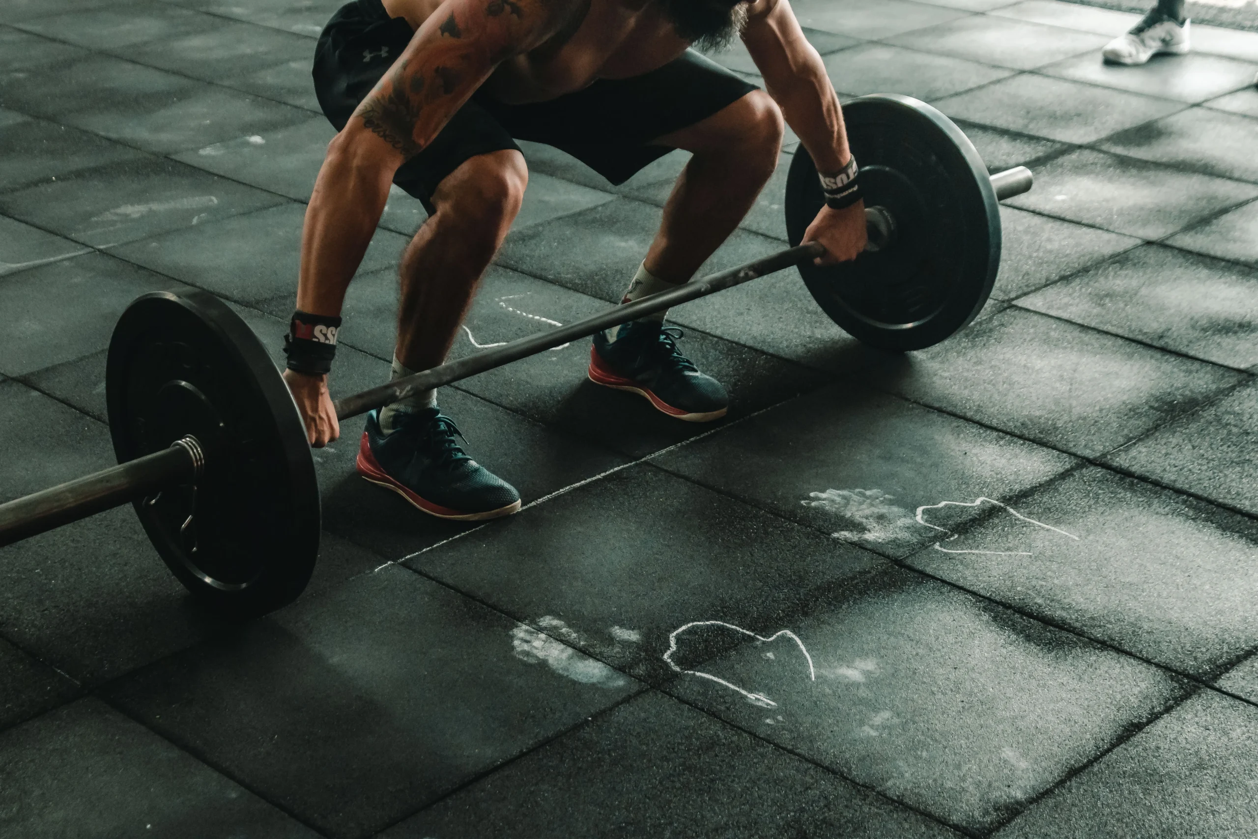 Man lifting weights in a gym